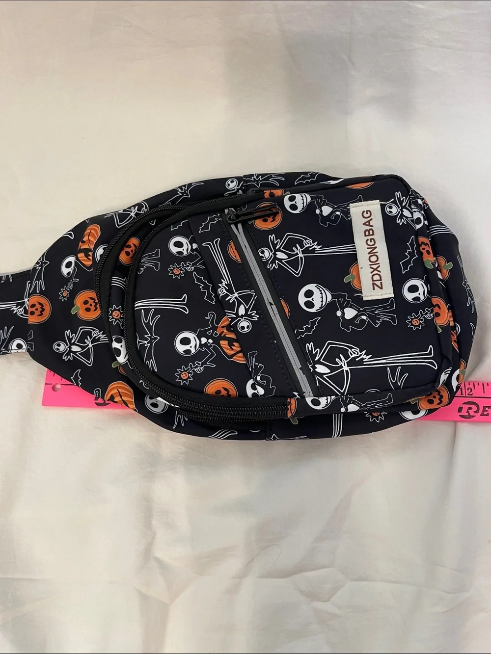 Halloween Jack Skeleton Sling Backpack - Black & Orange